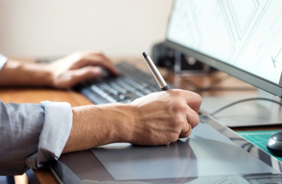 man doing graphic design at desk